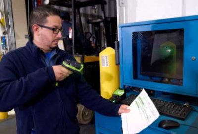 A man scanning a barcode with a scanner