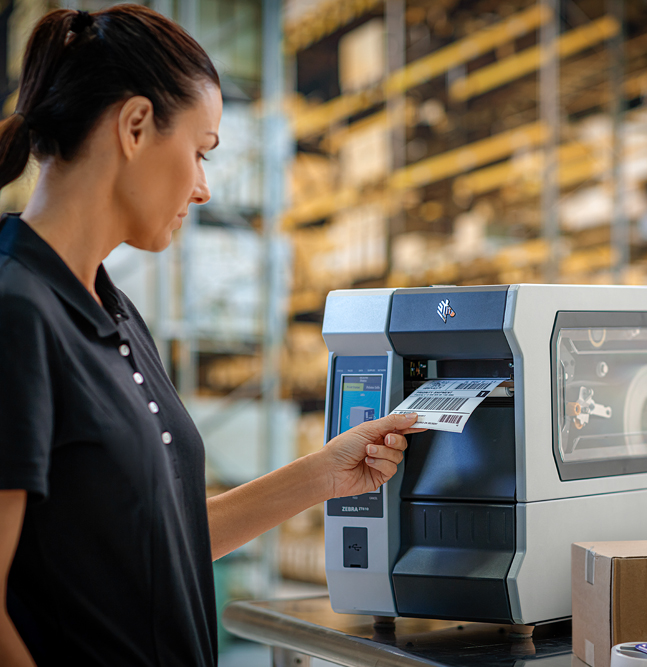 women with printer in warehouse