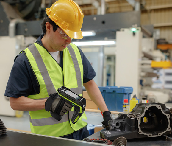 man scanning rfid in factory