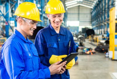 engineer workers looking at a tablet device