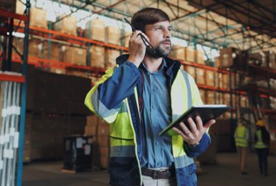 security man in warehouse trying to locate device